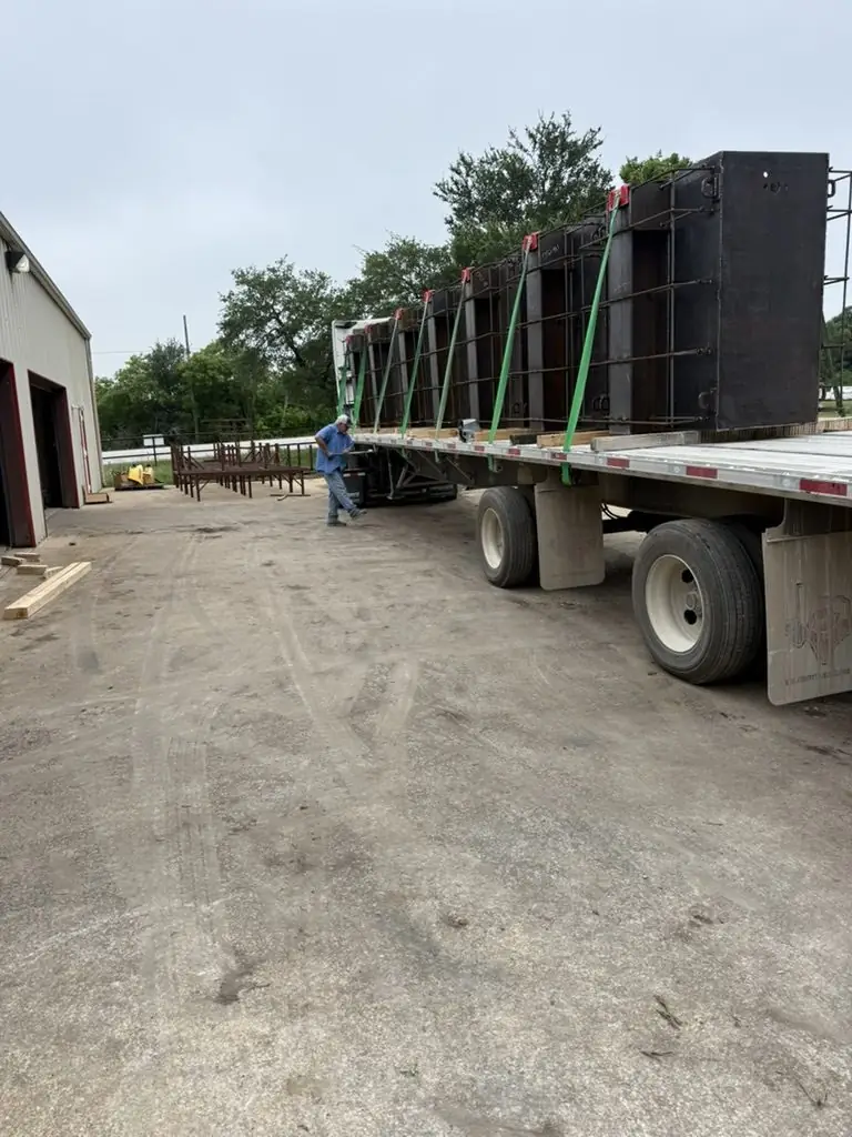 Enclosures loaded on a flatbed