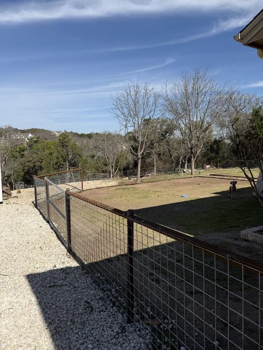 Pipe frame and wire panel yard fence