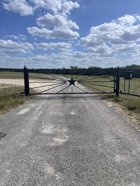 Ranch entrance gate with cut steel Texas star