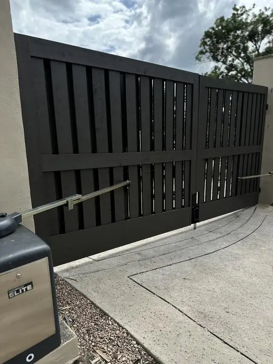 Automated swing gate with arm operator installed