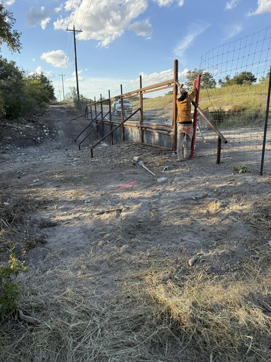 Setting pipe fence posts and bracing on site