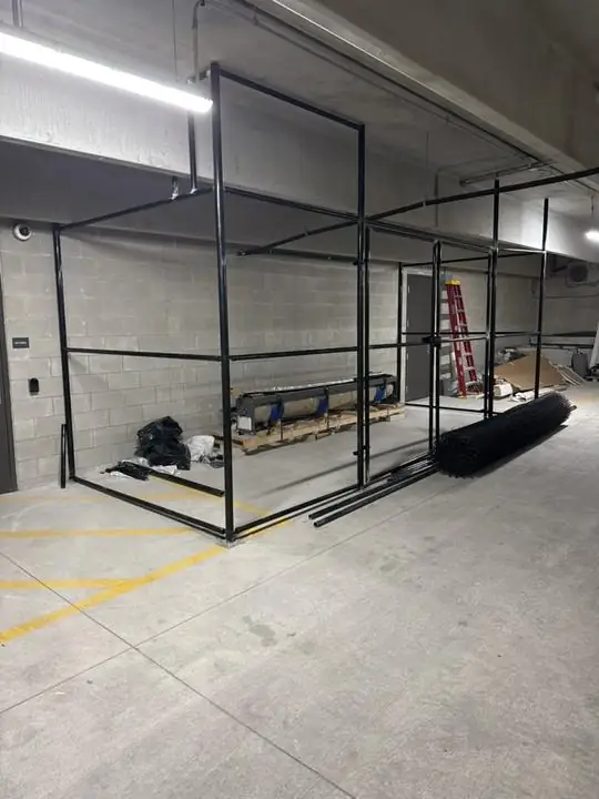 Steel enclosure frame going up in a parking garage