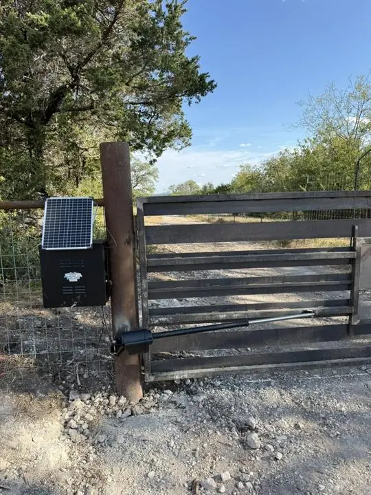Solar powered opener on a ranch drive gate