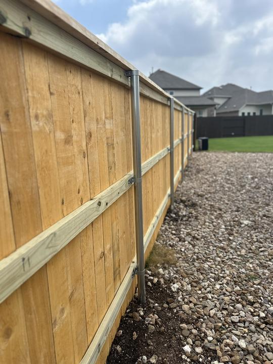 Cedar privacy fence built on steel posts