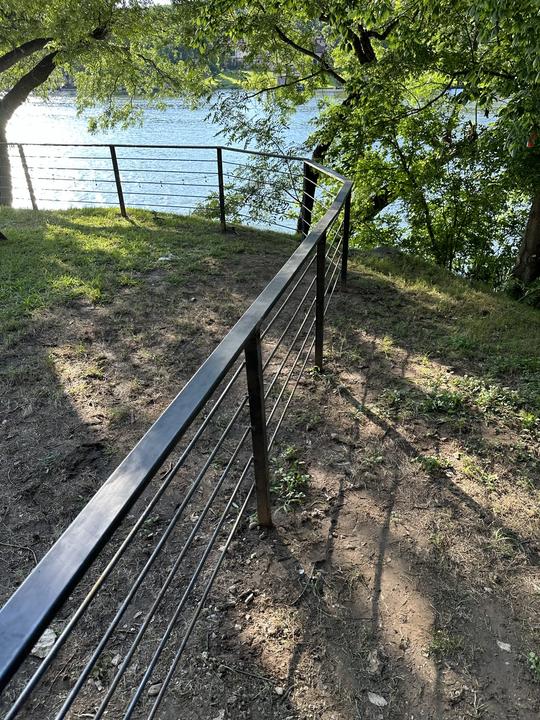 Steel rod rail fence along the waterfront