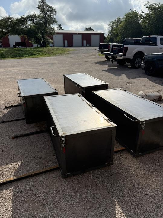 Four steel job boxes with lift sleeves