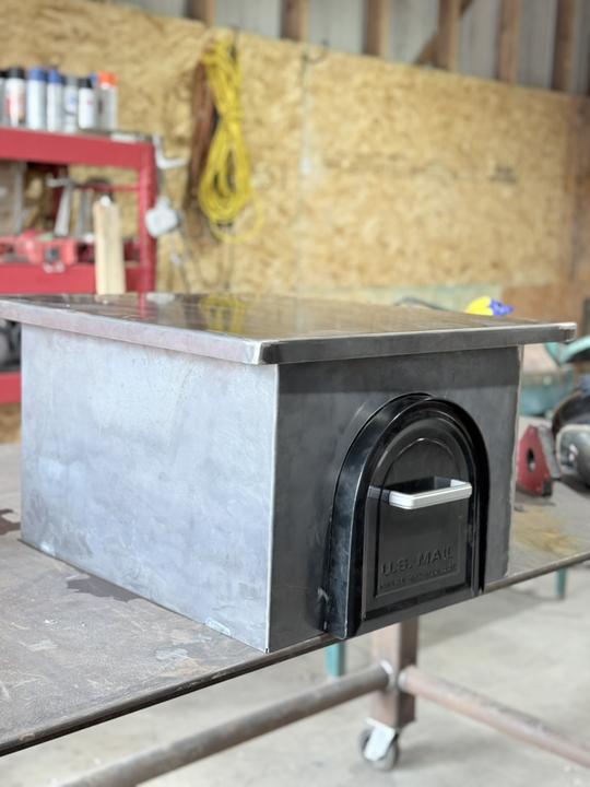 Steel mailbox enclosure fresh off the table