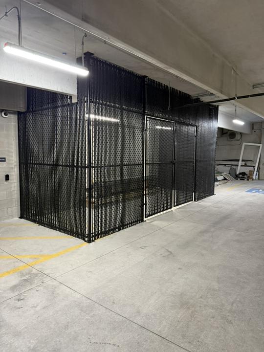 Secure storage cage in a parking garage