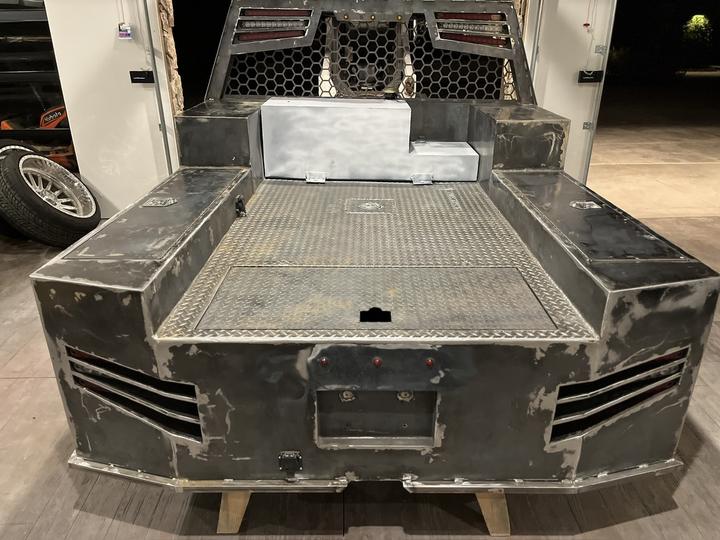 Truck bed rear view, diamond plate deck and toolboxes