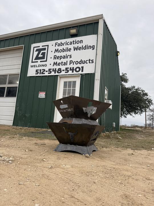 Two-tier Texas fire pit outside the shop