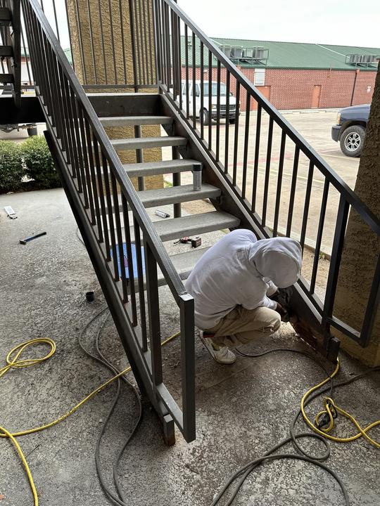 Fitting the base of a steel stair railing