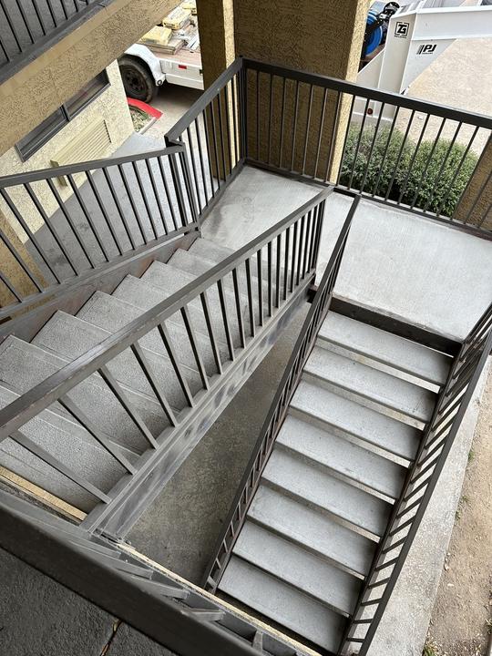 Commercial steel stair and guardrail, switchback layout