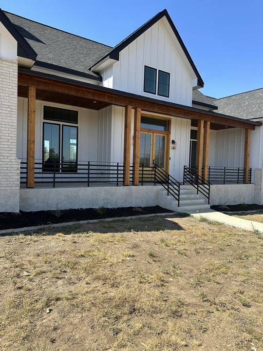 Front porch rail and stair rails on farmhouse