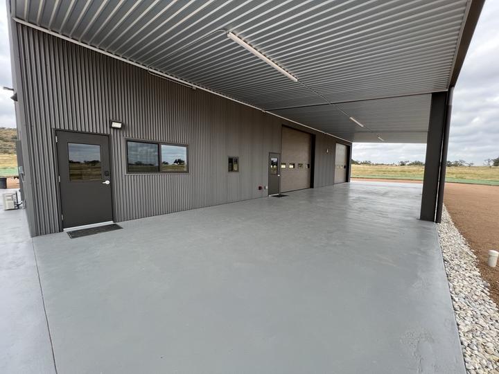 Covered porch running the length of the shop