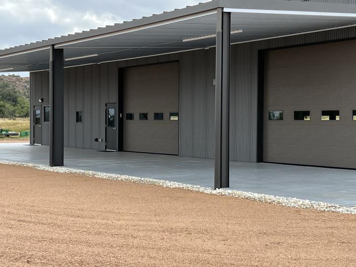 Covered bays with overhead doors and steel columns