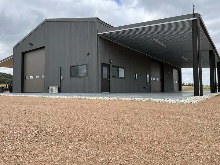 Finished steel shop, roll-up doors and wraparound porch