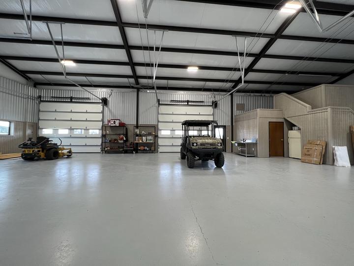 Finished shop interior with epoxy floor and loft