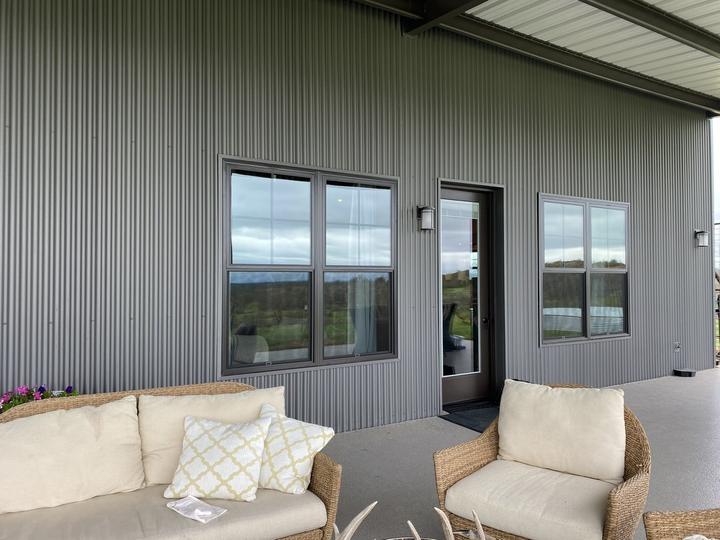 Covered patio outside a steel home