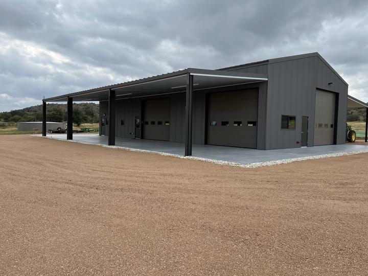 Steel shop with covered bays and three overhead doors