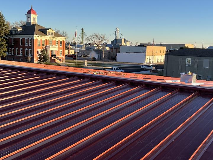 New standing seam roof panels at sunset
