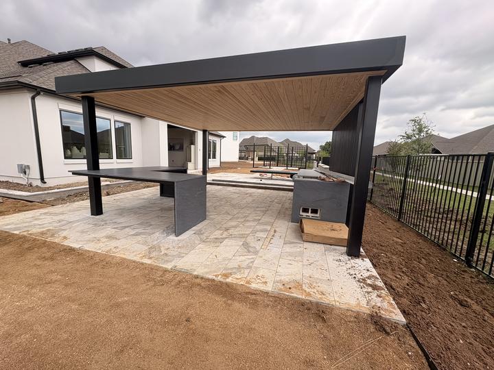 Cantilevered steel roof over an outdoor bar