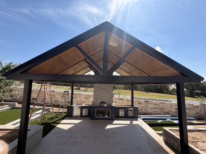 Gable pavilion with exposed steel trusses