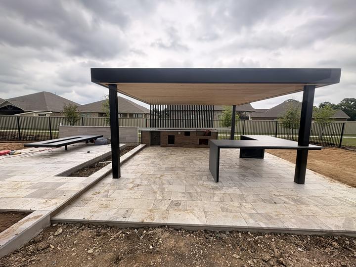 Flat-roof pergola over a travertine patio