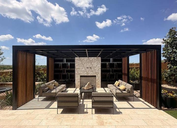Steel pergola with wood slat walls over a lounge